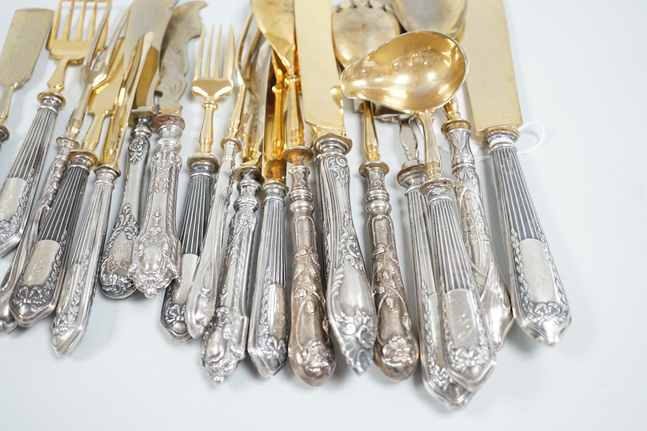 Nineteen assorted items of early 20th century Russian 84 zolotnik cutlery, including servers, butter knives, ladle etc, (loaded handles).